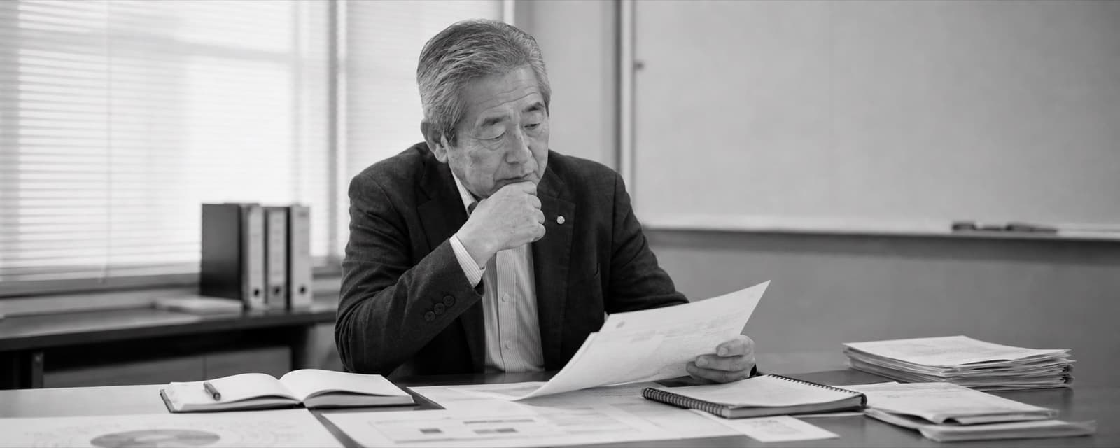 A company owner reading through documents